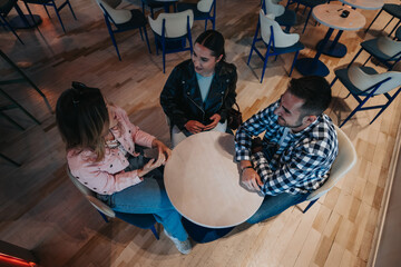 Two people talking together over coffee in bright daylight